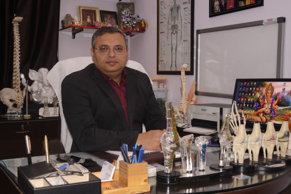 Dr. Deepak Arora sitting in his Ortho & Eye Center Krishna Nagar Delhi
